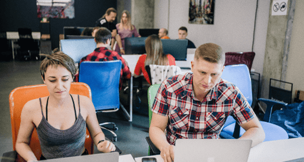 Developers working together on an AI chatbot customer self-service solution