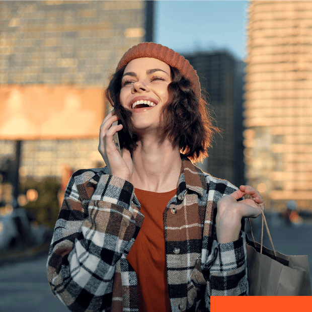 Smiling woman outdoors in an urban setting