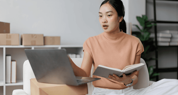 Woman using a laptop with an AI chatbot sales assistant