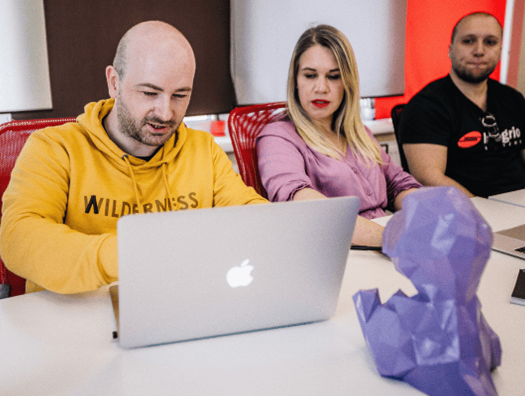 Three colleagues working on AI API integration