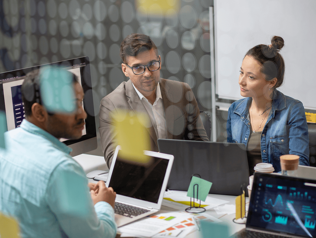Colleagues consulting a client about AI integration