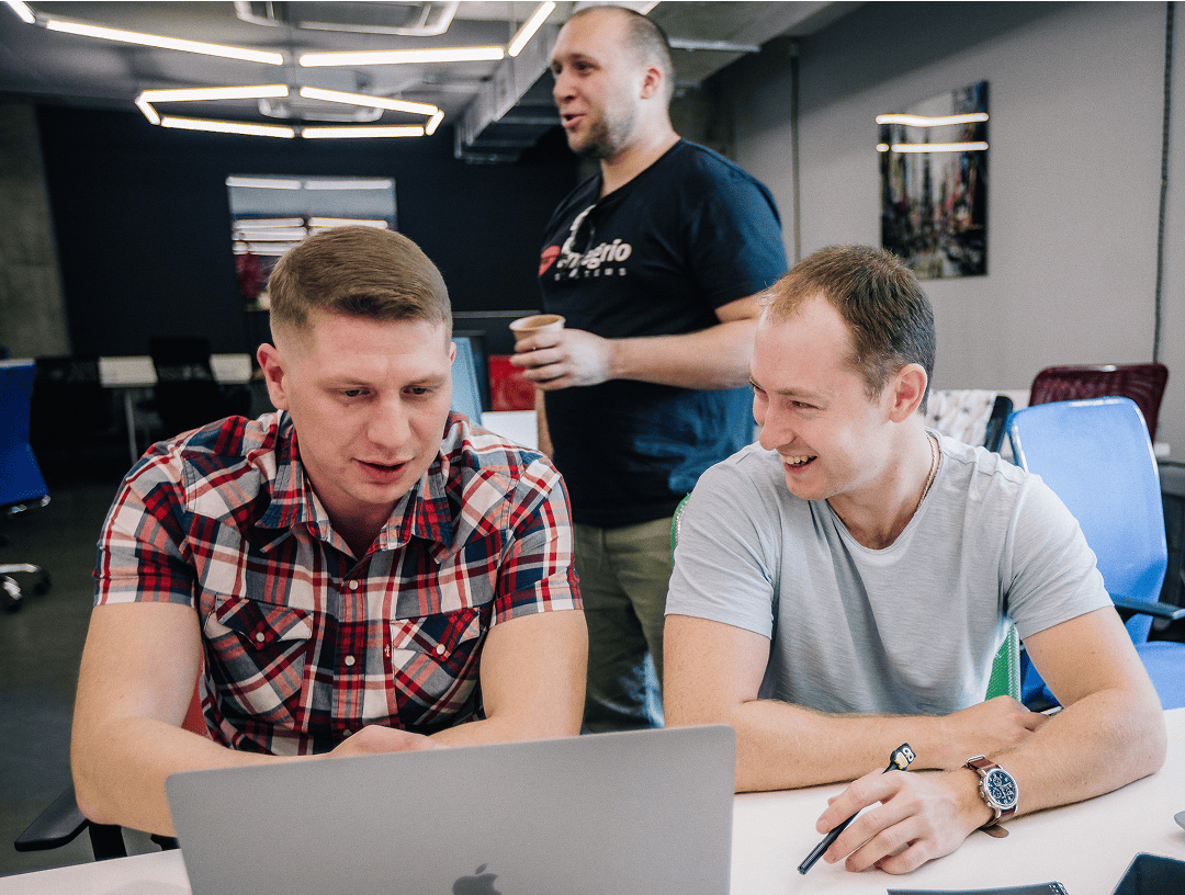 Three colleagues discussing AI integration for enterprise software