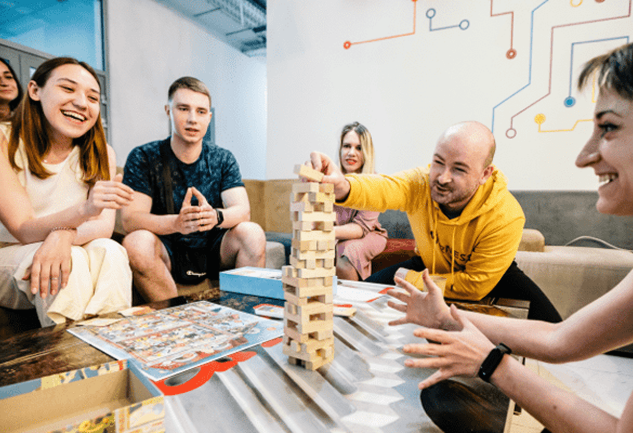 Integrio Team Members Team members playing a board game during a break